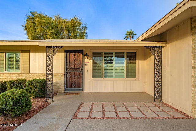 doorway to property with a patio area