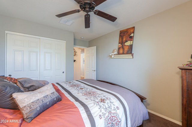 bedroom with carpet, ceiling fan, and a closet