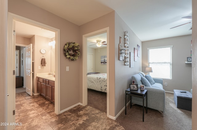 corridor featuring carpet floors and sink