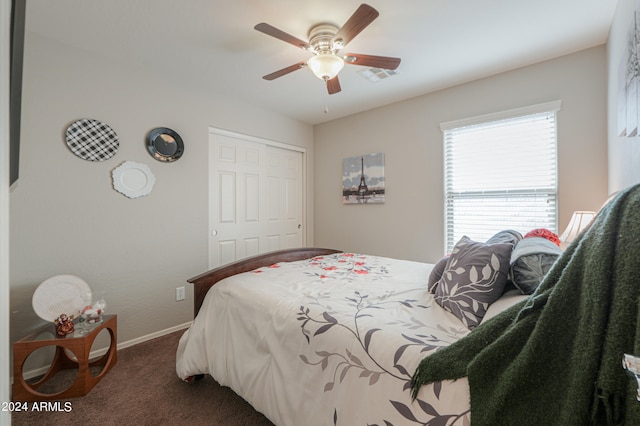 carpeted bedroom with a closet and ceiling fan