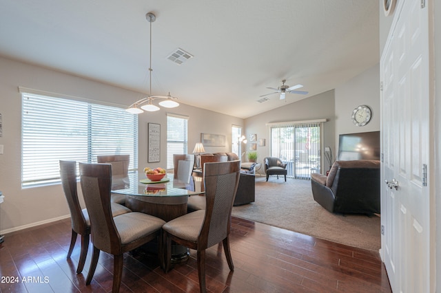 dining space with vaulted ceiling, dark hardwood / wood-style floors, and ceiling fan