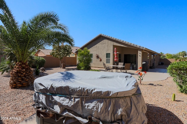 rear view of house with a patio