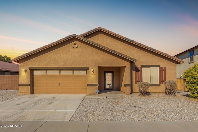 view of front of property with a garage