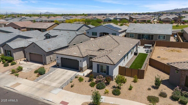 aerial view of residential area featuring a mountainous background