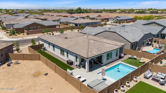 aerial perspective of suburban area with a pool