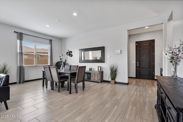 dining room featuring recessed lighting, baseboards, and light wood-style floors