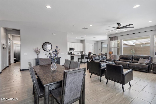 dining area featuring a ceiling fan, recessed lighting, healthy amount of natural light, baseboards, and light wood finished floors