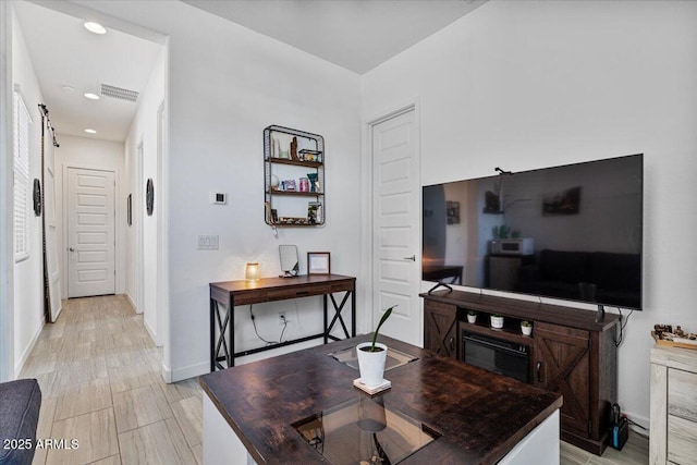 dining room featuring baseboards and recessed lighting