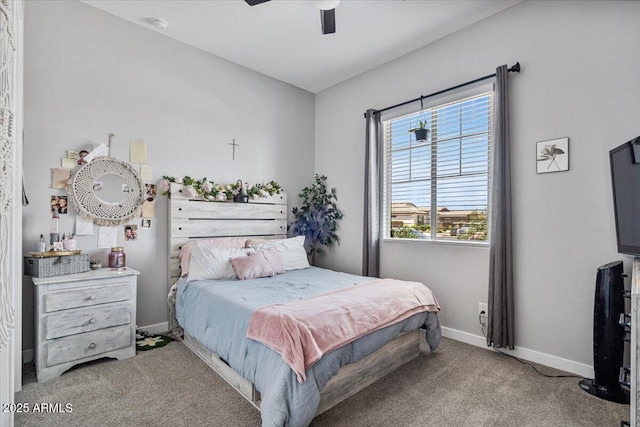 bedroom with carpet, baseboards, and a ceiling fan