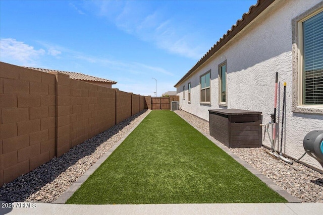 view of yard with central AC unit
