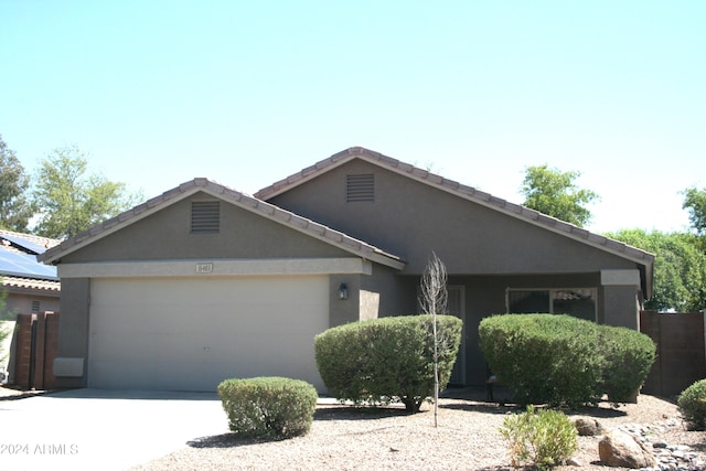 ranch-style home with a garage