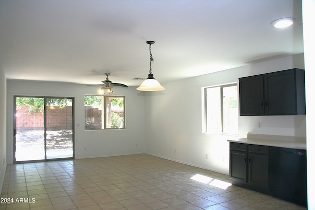 interior space with a healthy amount of sunlight, ceiling fan, and light tile patterned floors