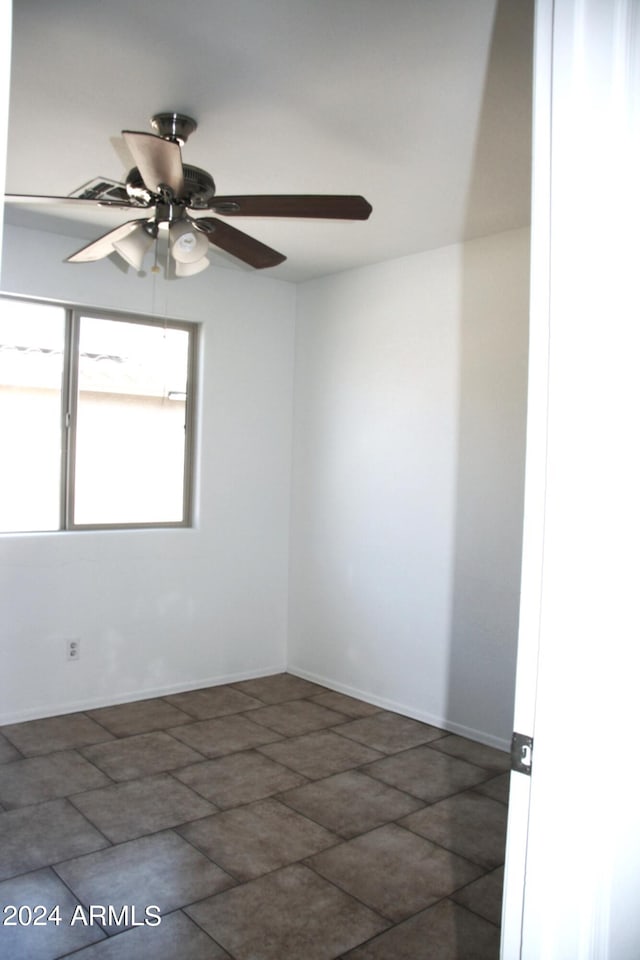 spare room featuring ceiling fan