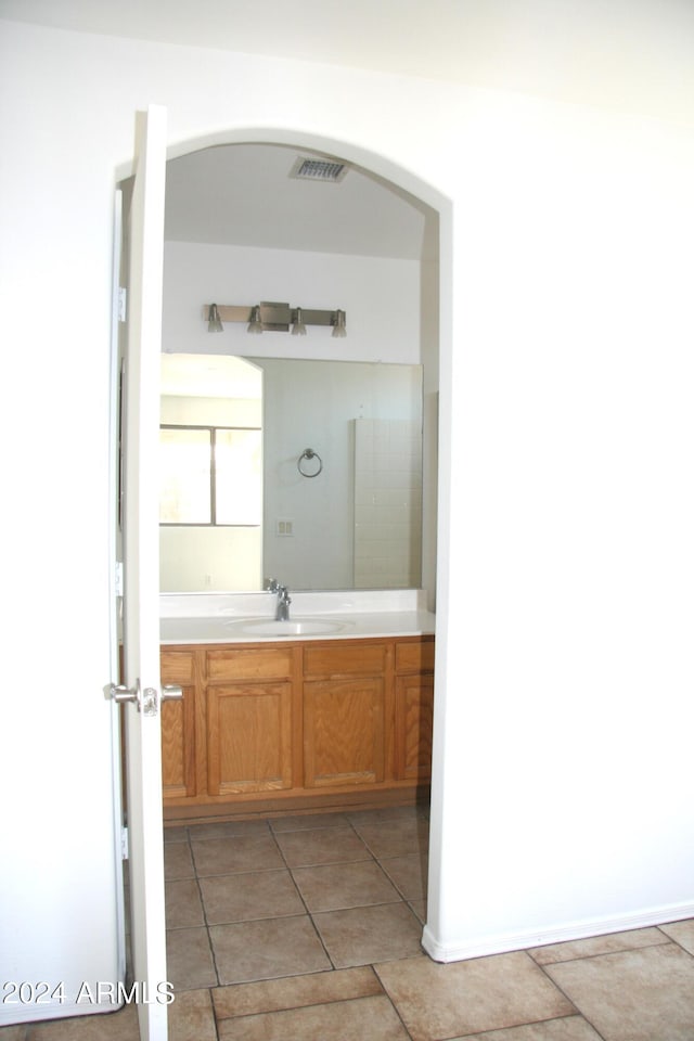 bathroom with vanity and tile patterned floors