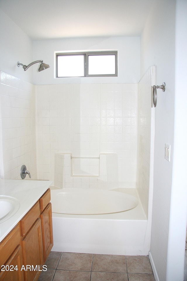 bathroom featuring vanity, tile patterned floors, and bathing tub / shower combination