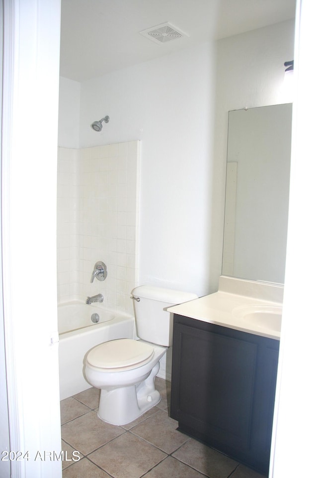 full bathroom featuring tile patterned floors, toilet, bathing tub / shower combination, and vanity