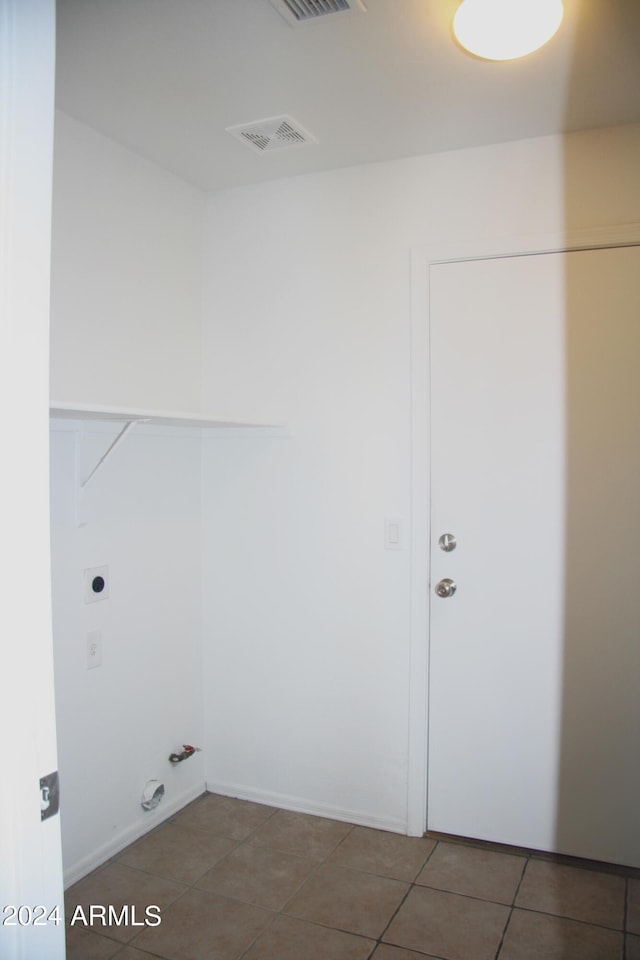 laundry room featuring tile patterned flooring and hookup for a gas dryer