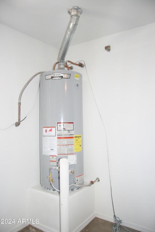 utility room featuring gas water heater