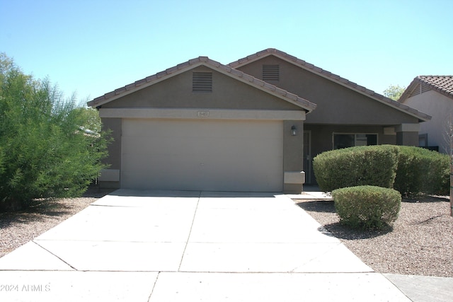 single story home with a garage