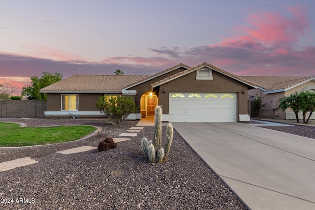 ranch-style home with a garage