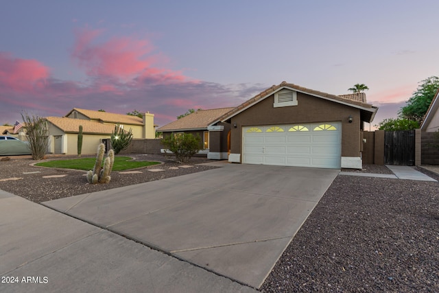 ranch-style home with a garage