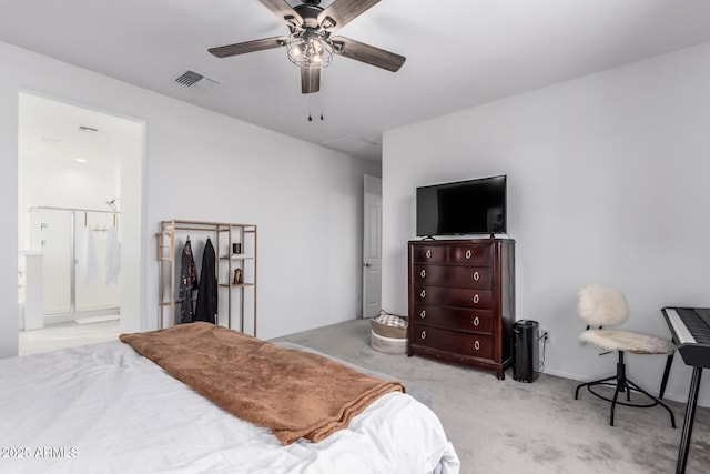 bedroom with visible vents, connected bathroom, ceiling fan, and carpet floors