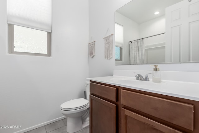 bathroom with baseboards, toilet, a shower with shower curtain, tile patterned floors, and vanity