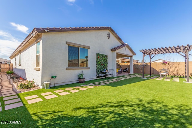 rear view of property featuring a lawn, stucco siding, a fenced backyard, a patio area, and a pergola