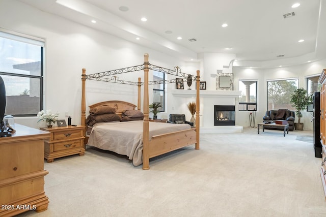 bedroom featuring light carpet