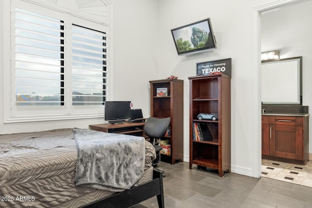 bedroom featuring ensuite bath