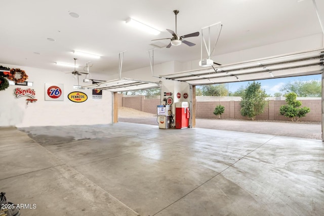 garage featuring a garage door opener and ceiling fan