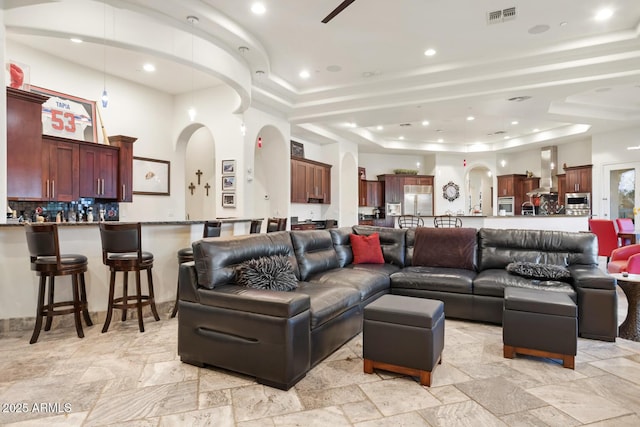 living room with a raised ceiling