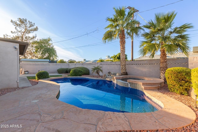 view of pool featuring an in ground hot tub