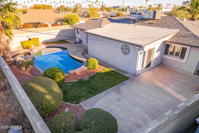 view of swimming pool featuring a patio area and an in ground hot tub