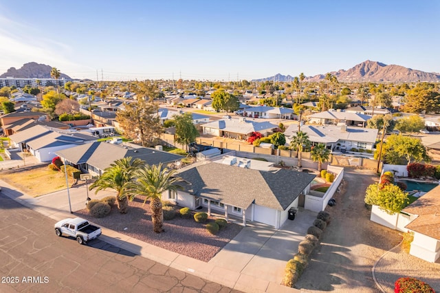 birds eye view of property featuring a mountain view