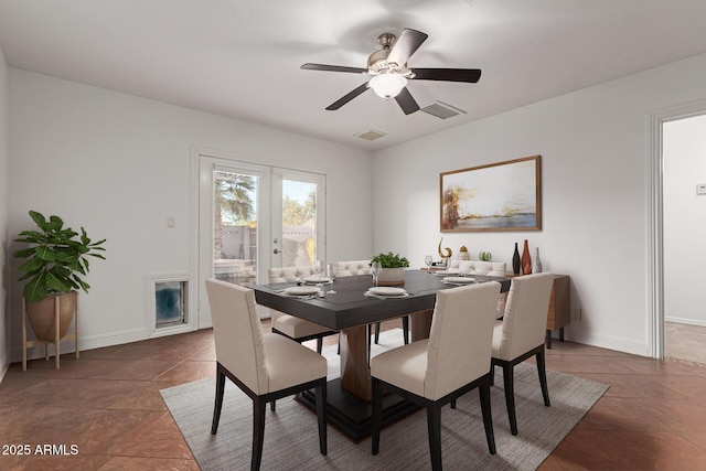 tiled dining room with french doors and ceiling fan