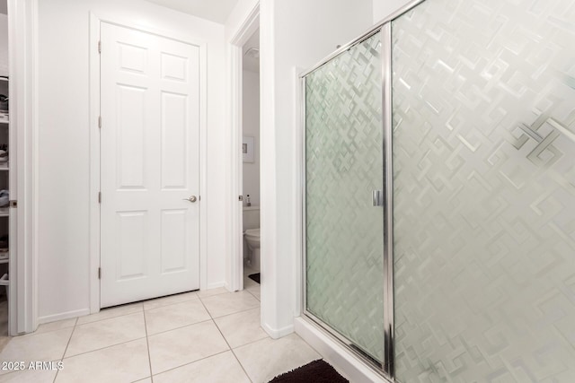 3415 S 75th Dr, Phoenix, AZ 85043 - bathroom featuring tile patterned floors, a stall shower, toilet, and baseboards