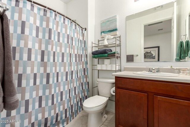 3415 S 75th Dr, Phoenix, AZ 85043 - bathroom with toilet, tile patterned floors, vanity, and curtained shower