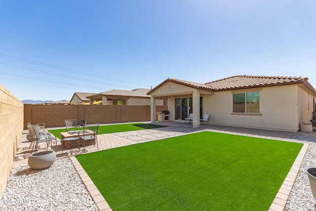3415 S 75th Dr, Phoenix, AZ 85043 - back of property featuring stucco siding, a tile roof, and a patio area