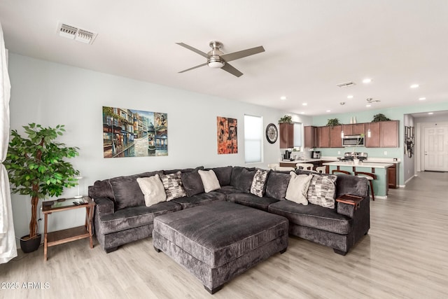 3415 S 75th Dr, Phoenix, AZ 85043 - living room featuring light wood-style floors, a ceiling fan, and recessed lighting