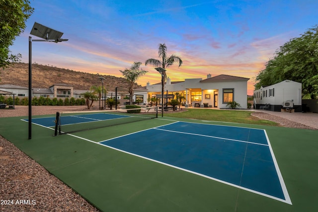 view of sport court with basketball hoop