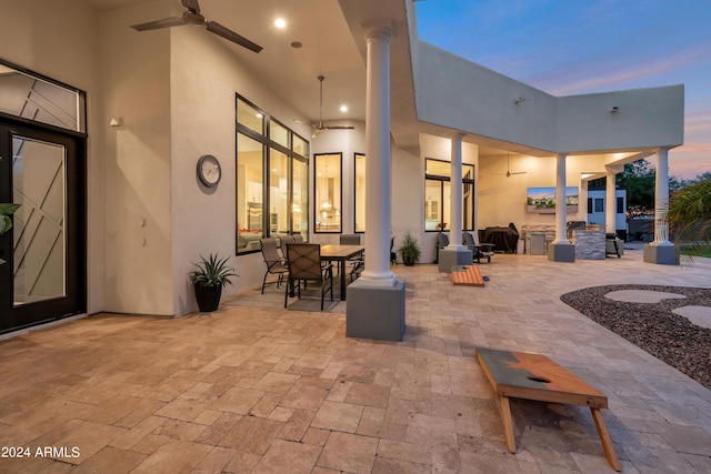 patio terrace at dusk with ceiling fan