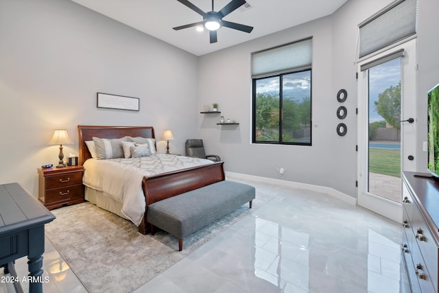 bedroom with access to exterior, multiple windows, and ceiling fan