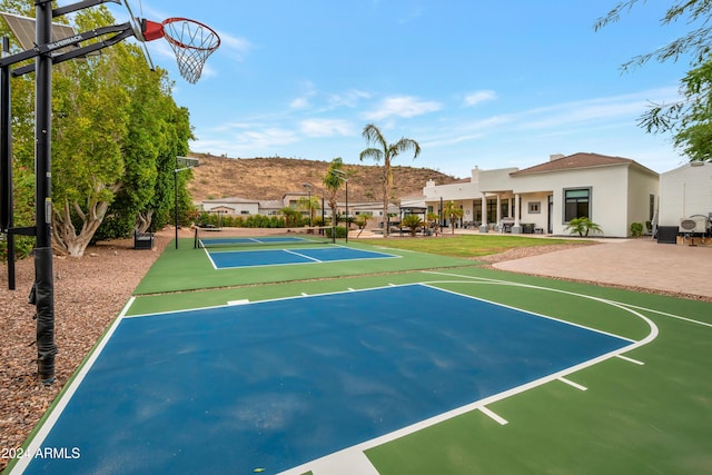 view of basketball court with tennis court