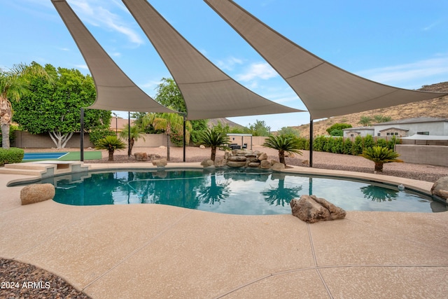 view of swimming pool featuring a patio area