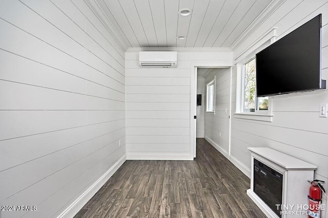 interior space featuring dark hardwood / wood-style flooring and an AC wall unit