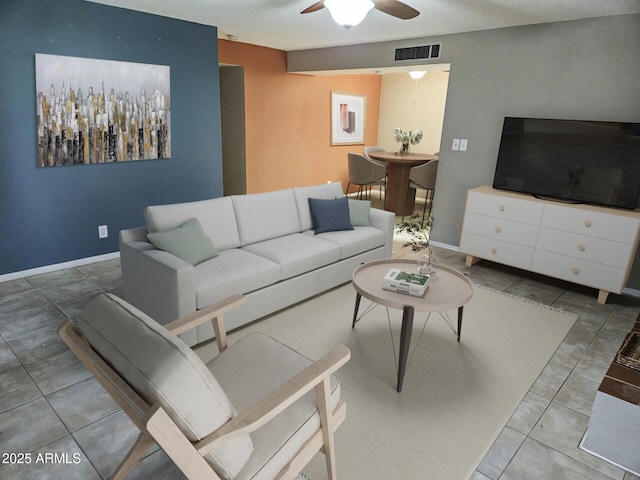 tiled living room with ceiling fan