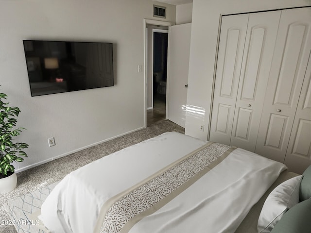 bedroom with a closet and carpet flooring