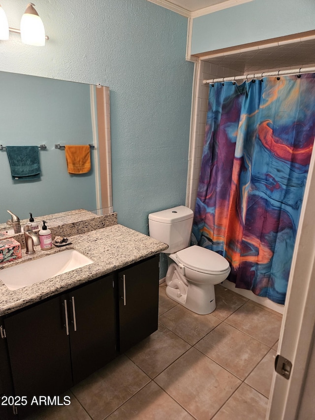 bathroom with tile patterned floors, vanity, toilet, and a shower with shower curtain