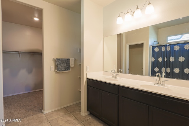 bathroom with tile patterned flooring and vanity